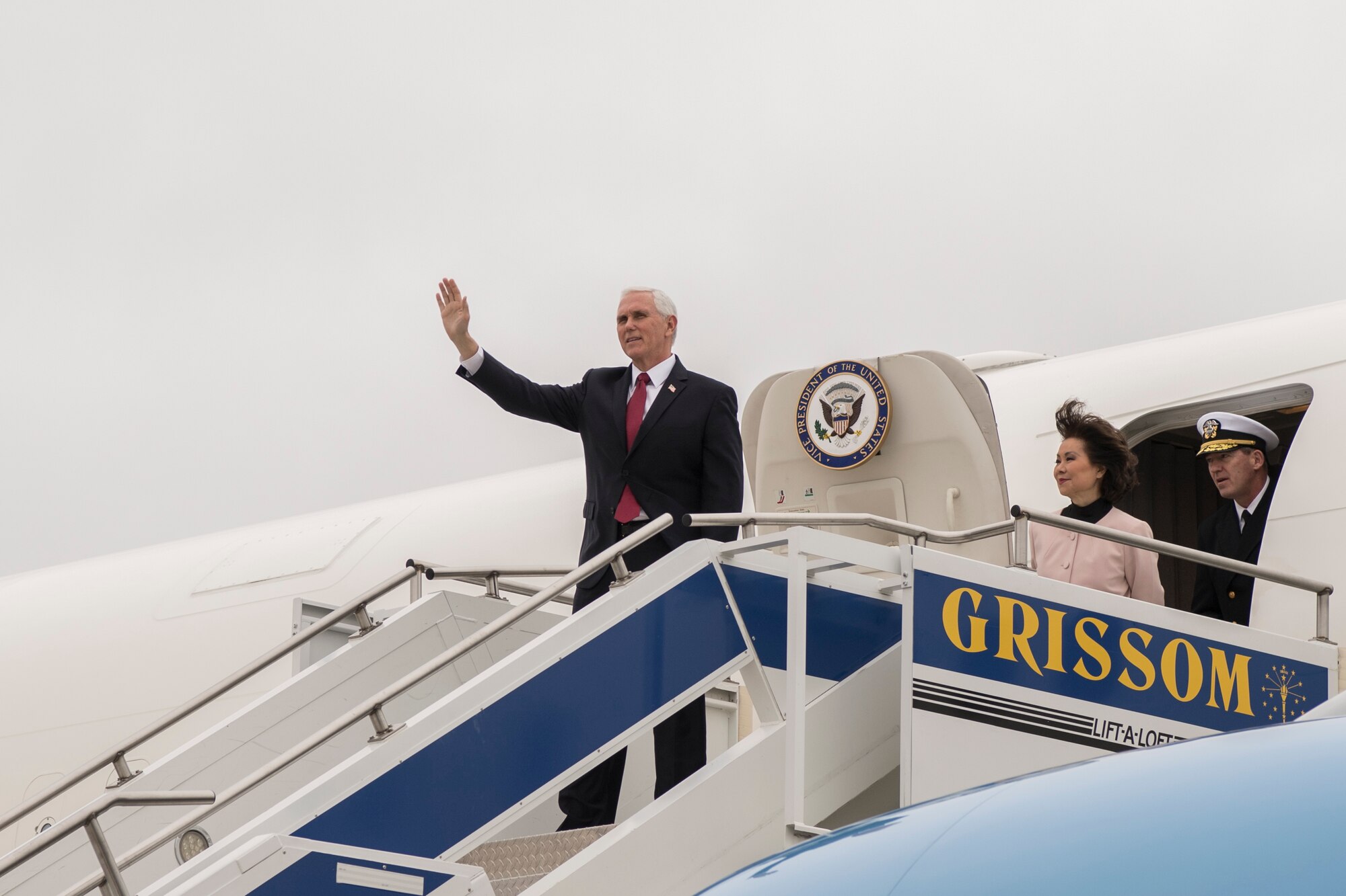 Vice President Mike Pence waves to news media after arriving at Grissom Air Reserve Base, Indiana April 30, 2020.Pence came to Indiana to meet with local business leaders who are building ventilators during the COVID-19 outbreak. (U.S Air Force photo/Ben Mota)