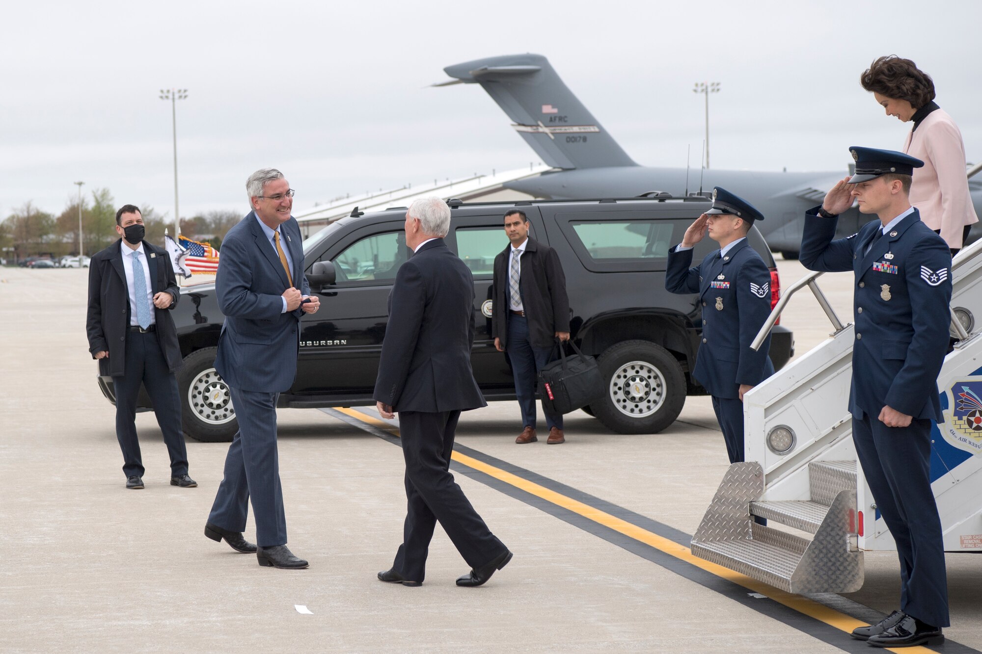 Indiana Governor Eric Holcomb greets Vice President Mike Pence after arriving at Grissom Air Reserve Base, Indiana April 30, 2020. Pence came to Indiana to meet with local business leaders who are building ventilators during the COVID-19 outbreak. (U.S Air Force photo/Ben Mota)