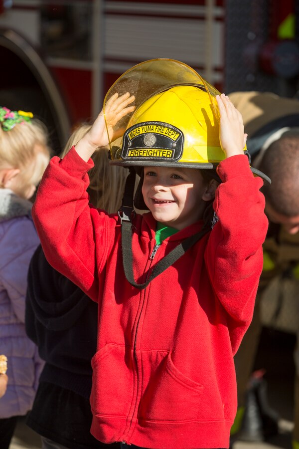 Students from the local community take a tour of aircraft rescue and firefighting during a field trip, Marine Corps Air Station Yuma, Feb. 6, 2020.