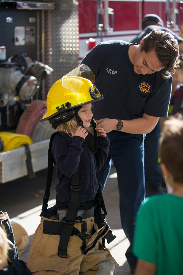 Students from the local community take a tour of aircraft rescue and firefighting during a field trip, Marine Corps Air Station Yuma, Feb. 6, 2020.