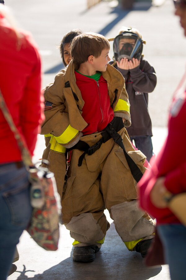 Students from the local community take a tour of aircraft rescue and firefighting during a field trip, Marine Corps Air Station Yuma, Feb. 6, 2020.