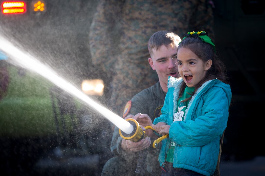 Students from the local community take a tour of aircraft rescue and firefighting during a field trip, Marine Corps Air Station Yuma, Feb. 6, 2020.