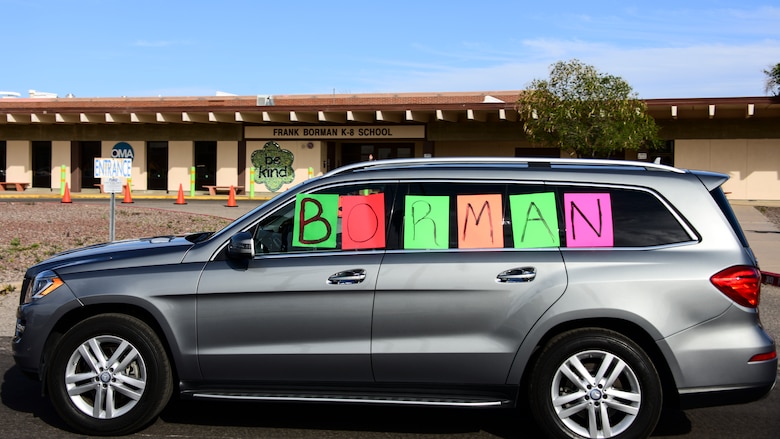 A photo of cars riding down the road