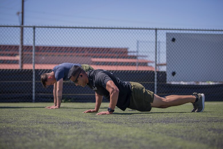 U.S. Marines with Marine Attack Squadron (VMA) 214, conduct physical training aboard Marine Corps Air Station (MCAS) Yuma, April 3, 2020. The training was conducted as part of their daily routine in preparation for the annual Physical Fitness Test. (U.S. Marine Corps photo by Lance Cpl John Hall)