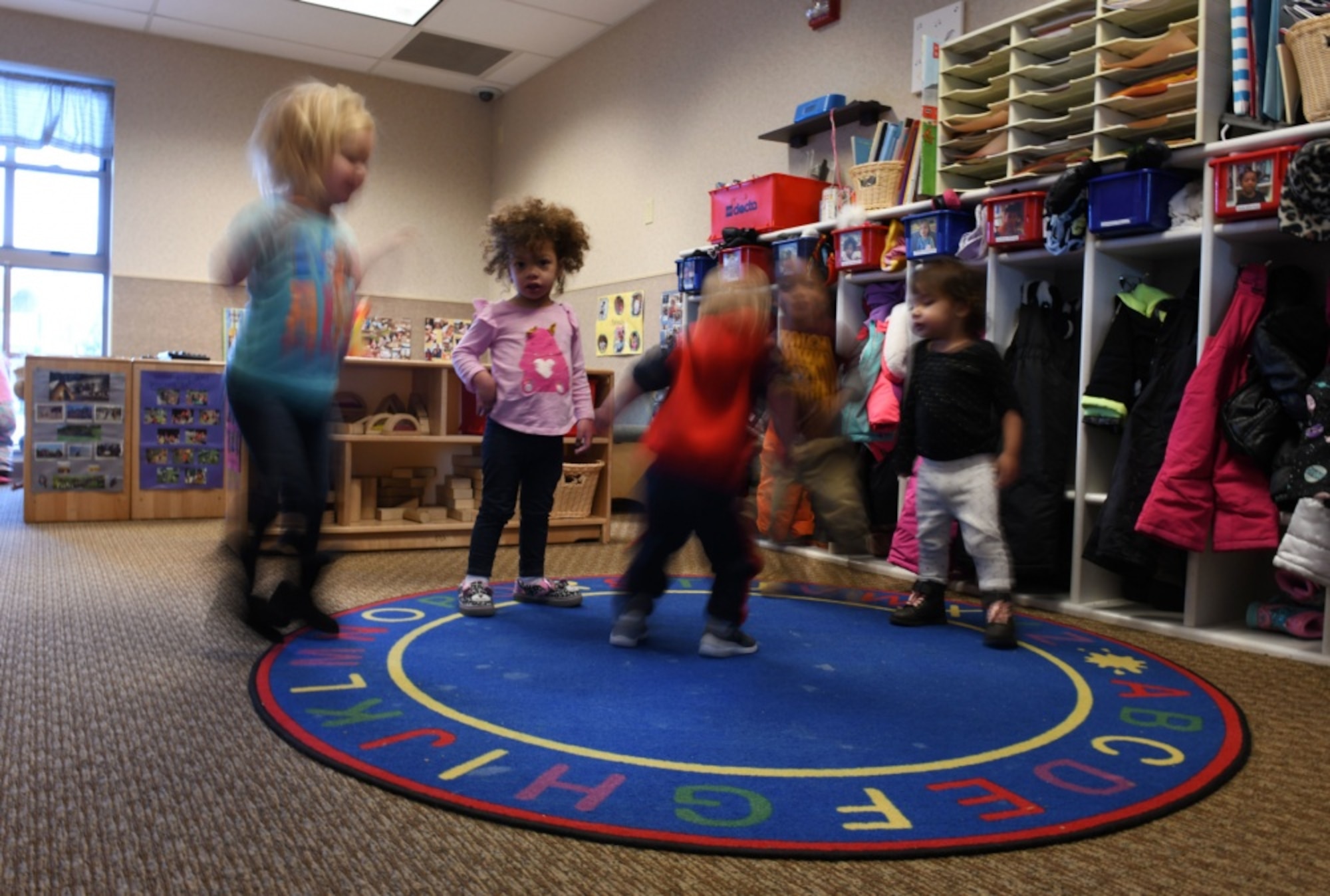 Toddlers from room 138 dance to "Jingle Bells" at the McRaven Child Development Center on Ellsworth Air Force Base, S.D., Dec. 6, 2018. April has been designated as the Month of the Military Child. It is set aside to honor the strength and sacrifices of military children across all branches. (U.S. Air Force photo by Airman 1st Class Christina Bennett)