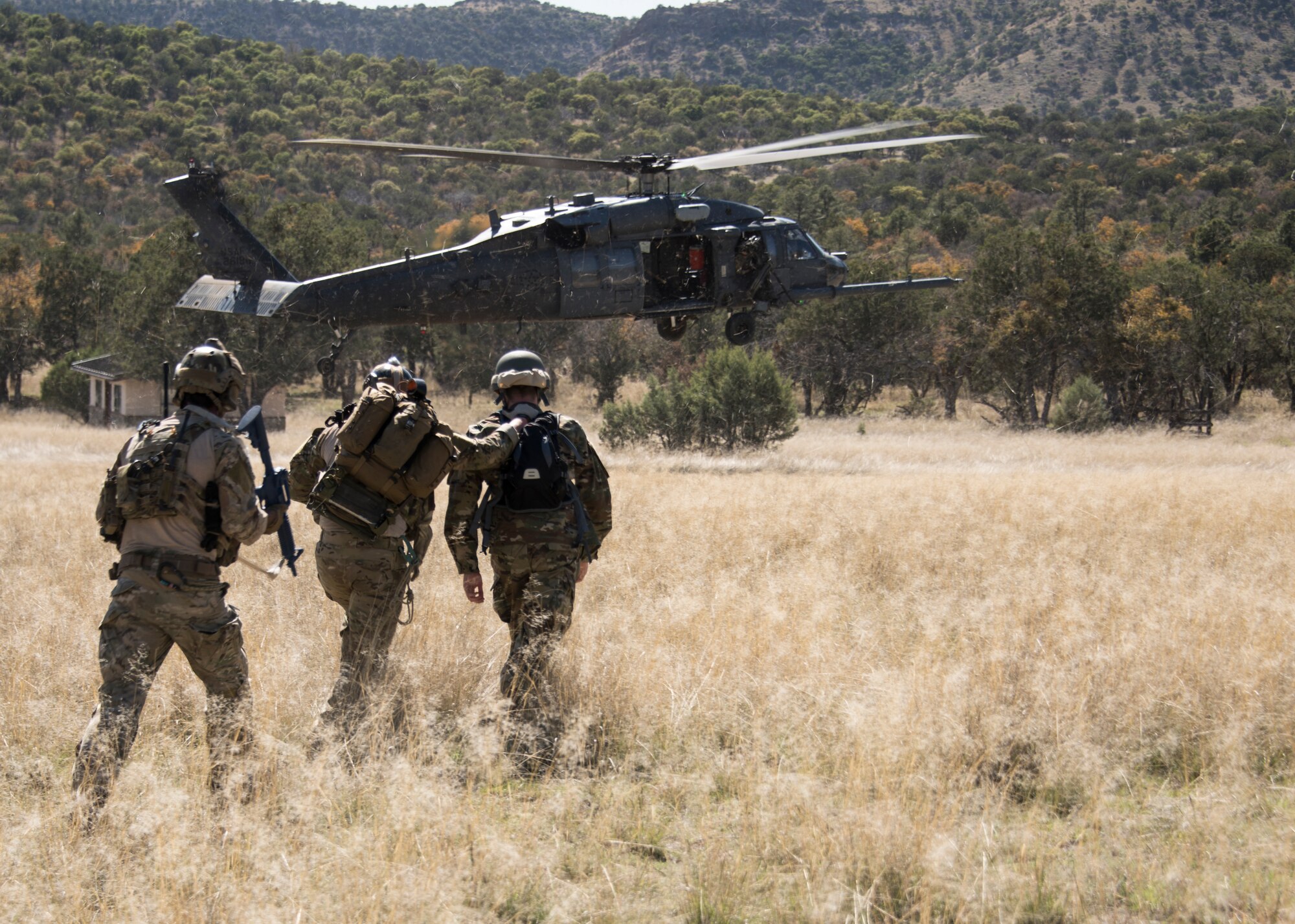 A photo of pararescueman executing a personnel recovery mission