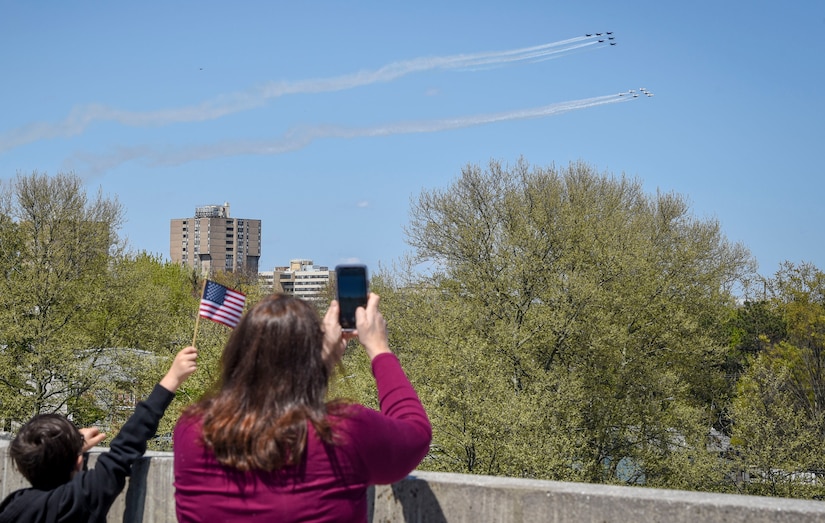 A photo of two people taking a photo of planes.
