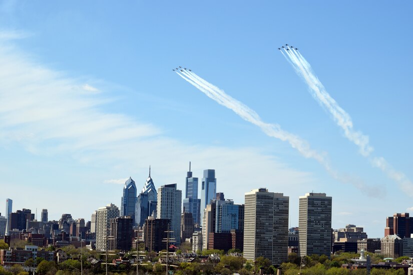 A photo of U.S. Air Force Thunderbirds and U.S. Navy Blue Angels flying.