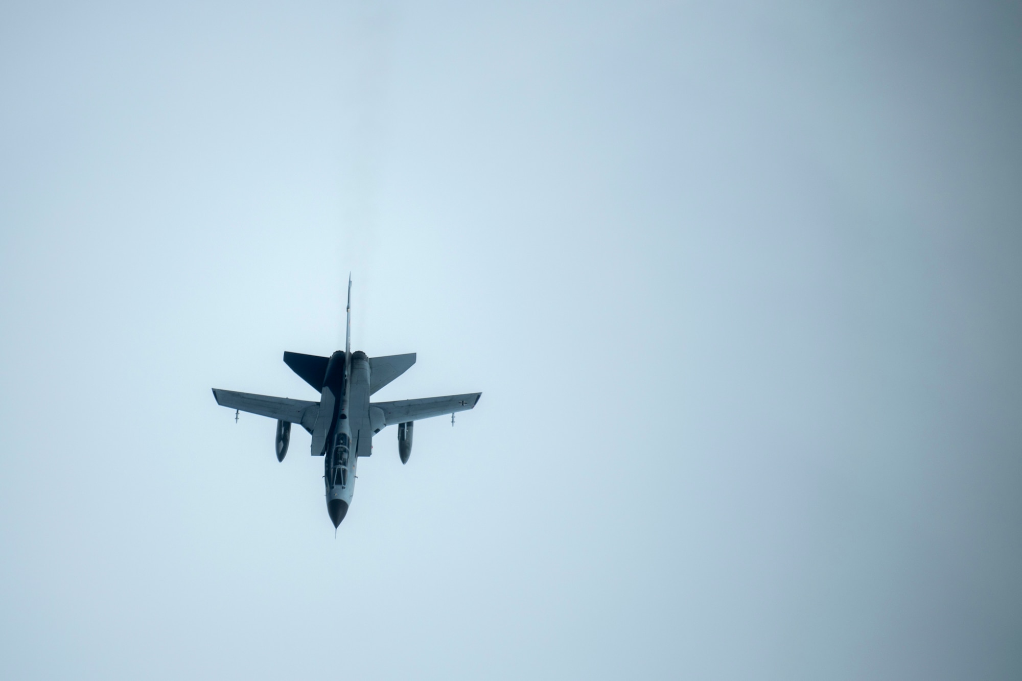 Military fighter aircraft in midair.