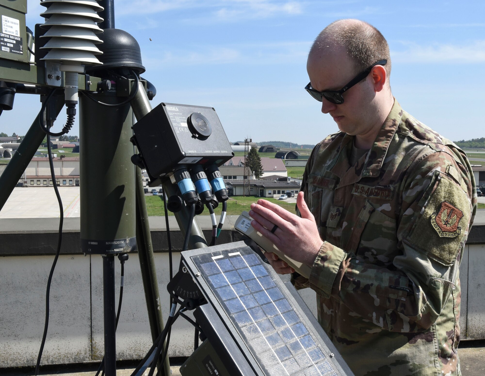 U.S. Air Force Staff Sgt. Bradley Gallaher, 52nd OSS Weather Flight training manager, uses a Tactical Meteorological Observation System (TMQ-53), at Spangdahlem Air Base, Germany, April 28, 2020. Gallaher has been maintaining mission readiness during the COVID-19 pandemic by ensuring records and training are up to date. (U.S. Air Force photo by Senior Airman Melody W. Howley)