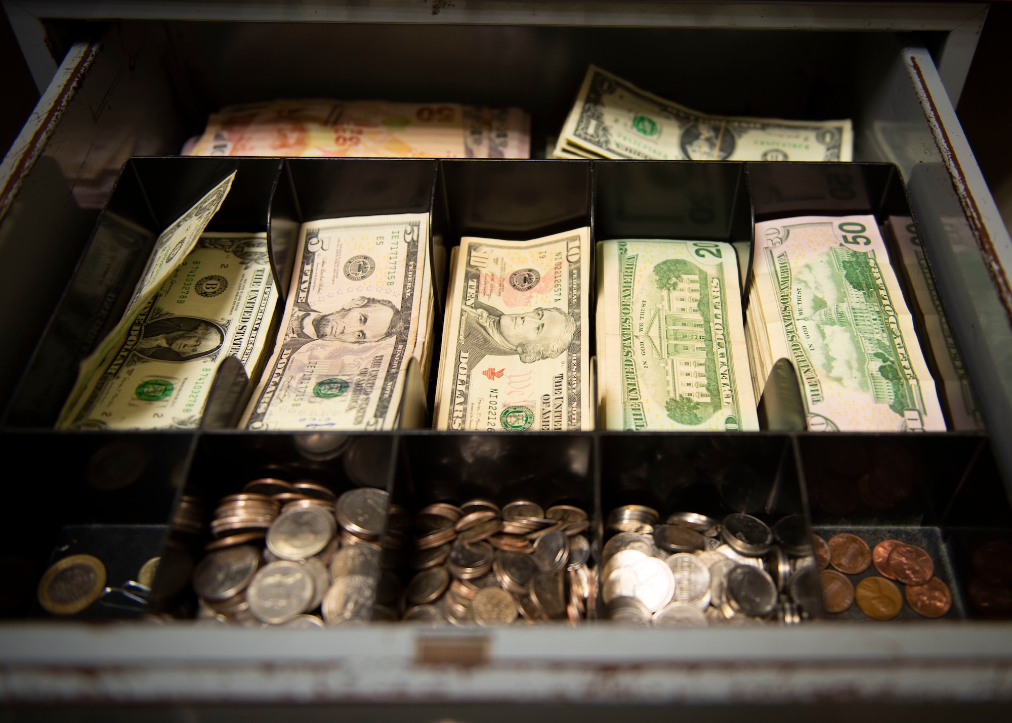 American and Turkish currency fill a cash box in the 39th Comptroller Squadron cash cage at Incirlik Air Base, Turkey, April 22, 2020.