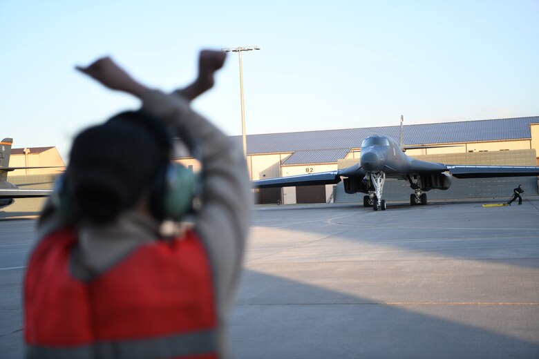 A B-1B Lancer assigned to the 28th Bomb Wing is guided out to the runway to launch from Ellsworth Air Force Base, S.D., April 28, 2020. A pair of B-1s flew from the continental United States and conducted operations over the South China Sea as part of a joint U.S. Indo-Pacific Command and U.S. Strategic Command Bomber Task Force mission. (U.S. Air Force photo by Senior Airman Nicolas Erwin)