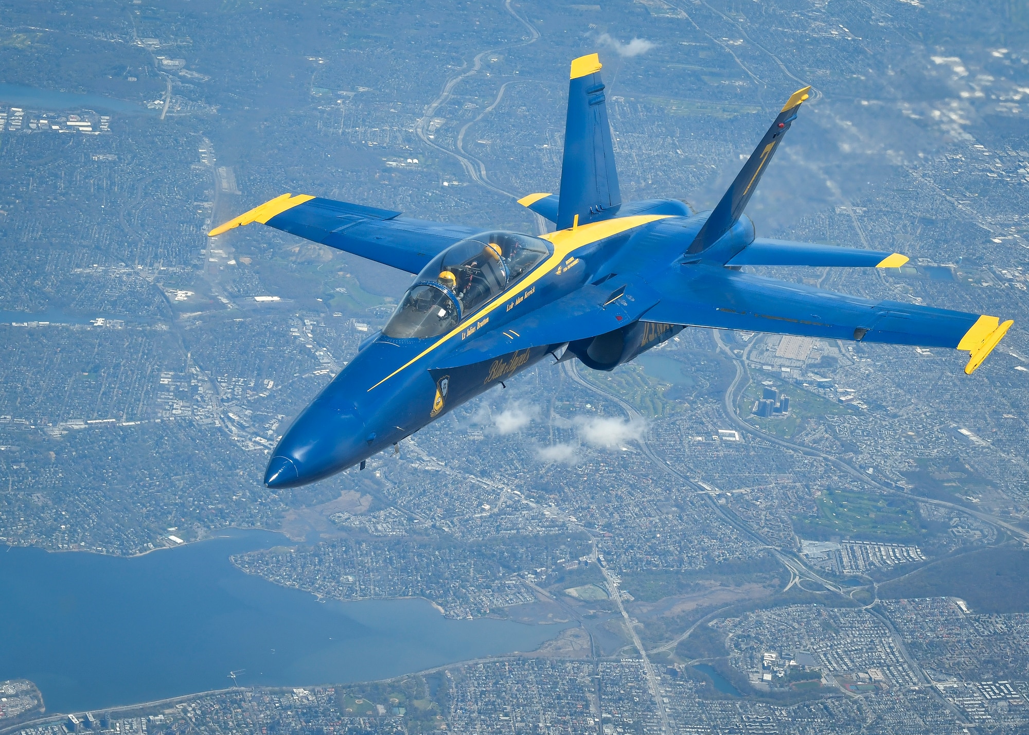 An F/A-18 Hornet assigned to the U.S. Navy Flight Blue Angels approaches a KC-10 Extender assigned to the 305th Air Mobility Squadron from Joint Base McGuire-Dix-Lakehurst, N.J., April 28, 2020. The Blue Angels conducted a joint flyover with the U.S. Air Force Thunderbirds as part of America Strong, an effort to honor healthcare workers, first responders and other essential personnel who are working on the front lines to combat COVID-19. (U.S. Air Force photo by Staff Sgt. Jake Carter)