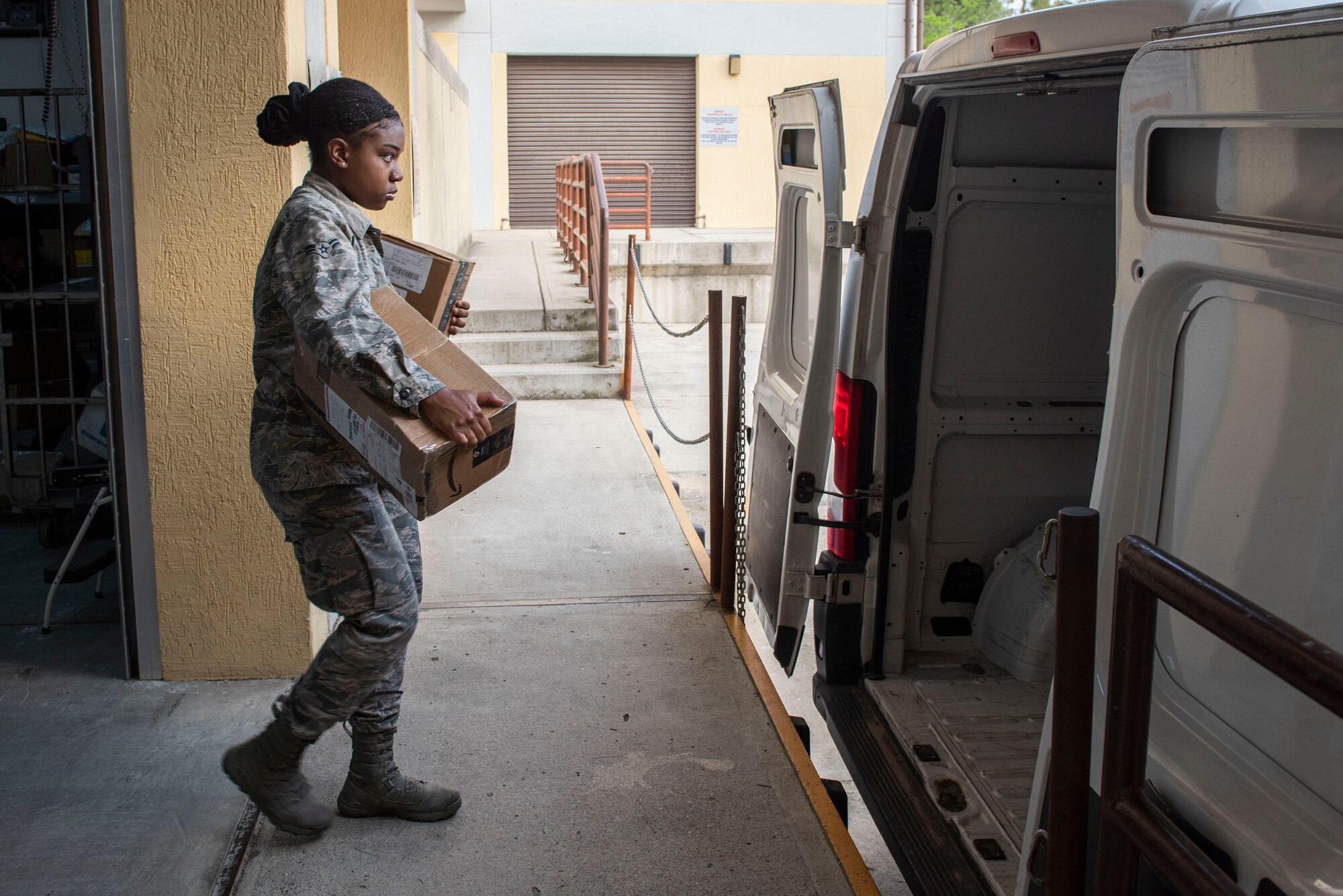 U.S. Air Force Airman 1st Class Erika Deal, 39th Force Support Squadron postal clerk, loads packages onto a van April 28, 2020, at Incirlik Air Base, Turkey. The packages were bound for one of the operating locations in Turkey where U.S. troops are staged. (U.S. Air Force photo by Staff Sgt. Joshua Magbanua)