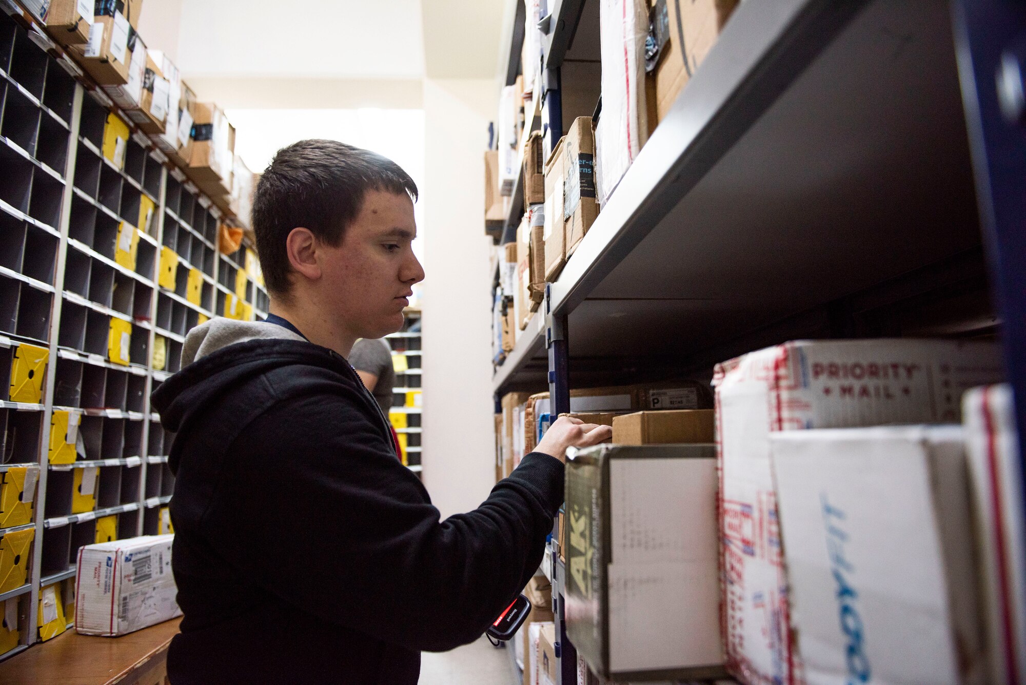 U.S. Air Force Senior Airman Anthony Ramminger, 39th Force Support Squadron postal clerk, scans packages at the post office April 24, 2020, at Incirlik Air Base, Turkey. The base post office receives and sends out mail for U.S. Airmen stationed at Incirlik. (U.S. Air Force photo by Staff Sgt. Joshua Magbanua)
