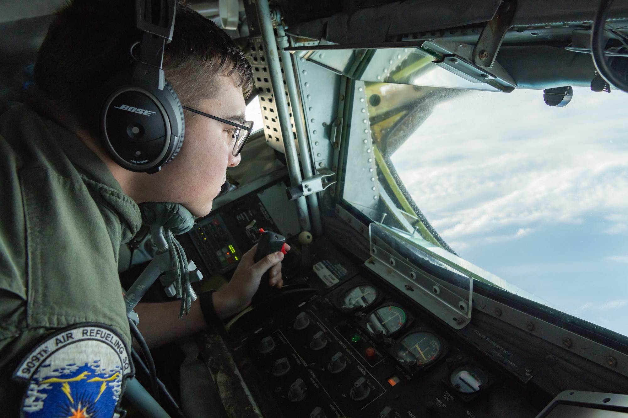 U.S. Air Force Airman 1st Class Dillon Neal, boom operator assigned to the 909th Air Refueling Squadron, prepares to refuel a B-1B Lancer from the 28th Bomb Wing, Ellsworth Air Force Base, S.D., during a 32-hour round-trip sortie to conduct operations over the Pacific as part of a joint U.S. Indo-Pacific Command and U.S. Strategic Command (USSTRATCOM) Bomber Task Force (BTF) mission April 30, 2020. The 909th ARS enables the execution of tactical, conventional, and peacetime operations in the Indo-Asia Pacific region. (U.S. Air Force photo by Senior Airman Cynthia Belío)