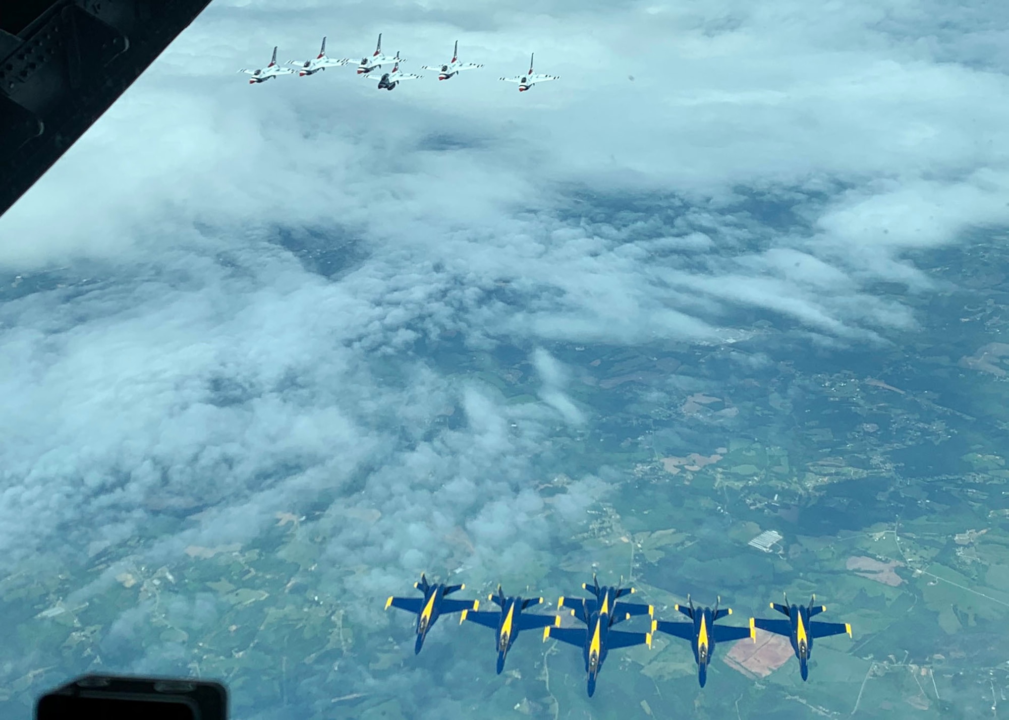 The U.S. Air Force Thunderbirds and U.S. Navy Blue Angels flew in formation behind a KC-10 Extender assigned to Joint Base McGuire-Dix-Lakehurst, N.J., April 28, 2020. The demonstration teams flew over New York, New Jersey and Pennsylvania to honor thousands of healthcare workers, essential employees, military personnel and other first responders who are at the front lines of the battle against COVID-19. (U.S. Air Force photo by Chief Master Sgt. Christopher Ottenwess)