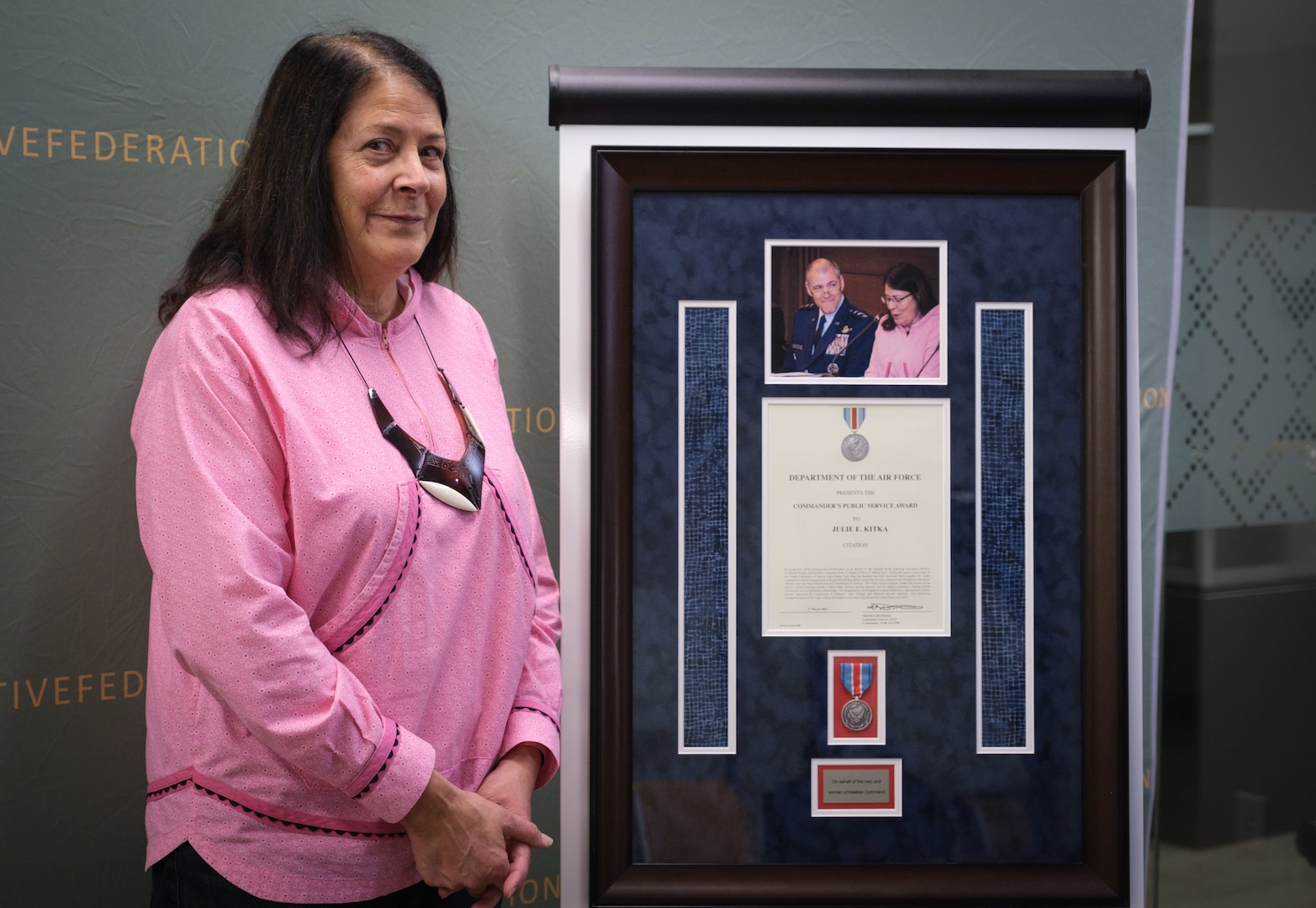 Ms. Julie Kitka, president of the Alaska Federation of Natives shows the Commander’s Public Service Award given her by Lt. Gen. Thomas A. Bussiere, former commander of Alaskan North American Aerospace Defense Command Region, Alaskan Command, and Eleventh Air Force April 16, 2020, at Anchorage, Alaska. The award showcased Kitka’s dedication to the bridging of cultural differences and ceaseless efforts directly supported the Department of Defense’s Arctic Strategy and National Security interests.