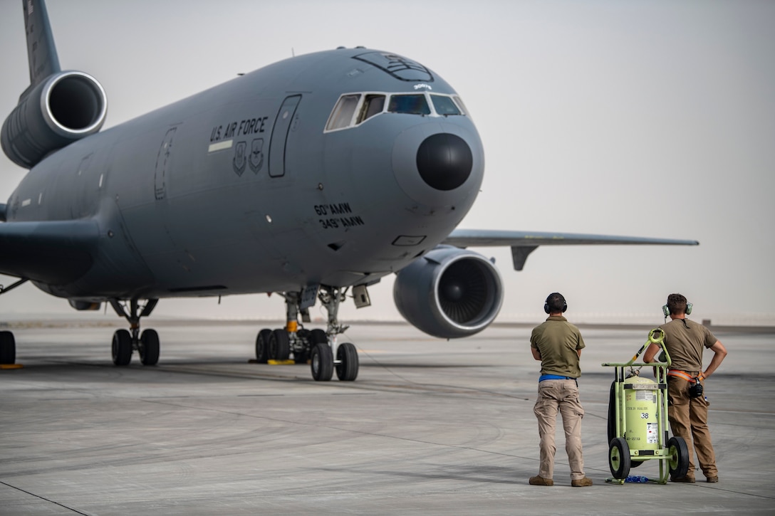 Members of the 380th Expeditionary Aircraft Maintenance Squadron monitor a KC-10 Extender as it prepares for takeoff during an exercise here July 21, 2020.