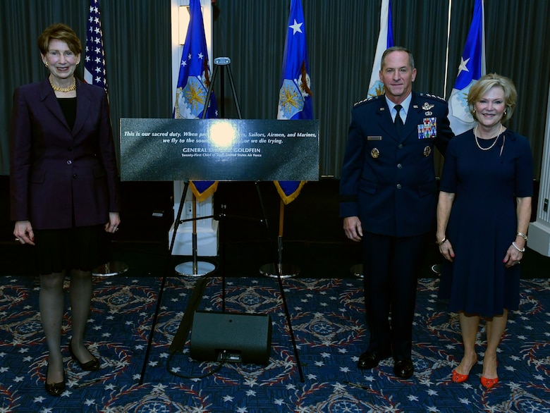Secretary of the Air Force Barbara M. Barrett, left, Air Force Chief of Staff David L. Goldfein and Mrs. Dawn Goldfein pose with a representation of an etching that is now displayed on the Wall of Valor at the Air Force Memorial during a ceremony at Joint Base Anacostia-Bolling, Washington, D.C., July 31, 2020. The ceremony unveiled a new etching for the memorial's Wall of Valor at the Air Force Memorial that reads, 