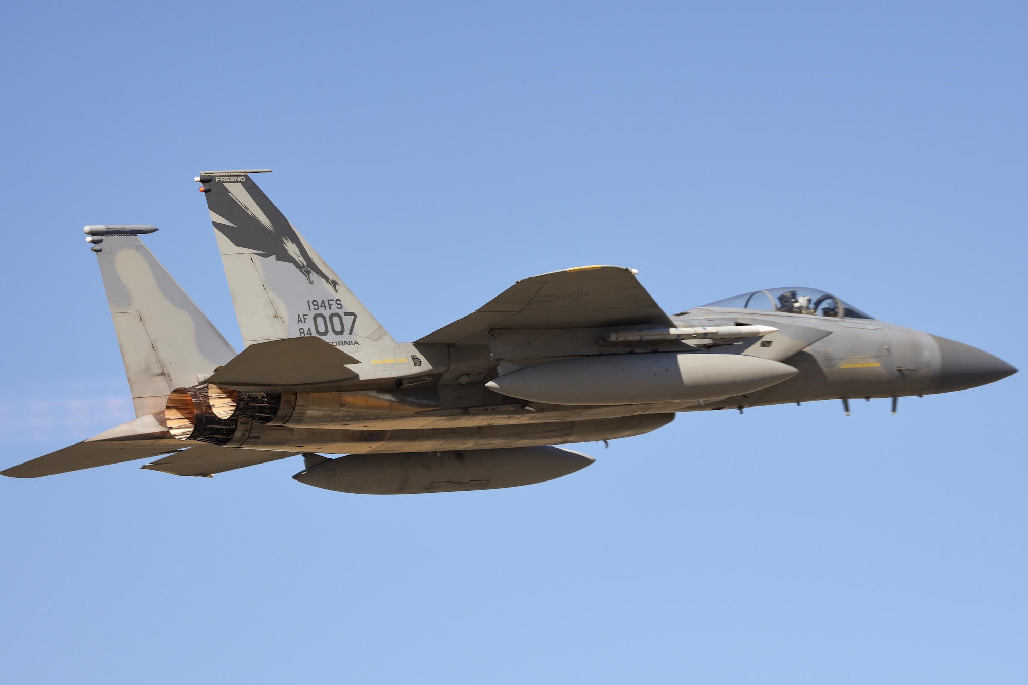 An F-15C Eagle from the 144th Fighter Wing takes off from the Fresno Yosemite International Airport during a clear afternoon, June 26, 2020, to conduct a routine training mission, ensuring pilots maintain required training hours and the Wing maintains mission readiness. (U.S. Air National Guard photo by Capt. Jason Sanchez)