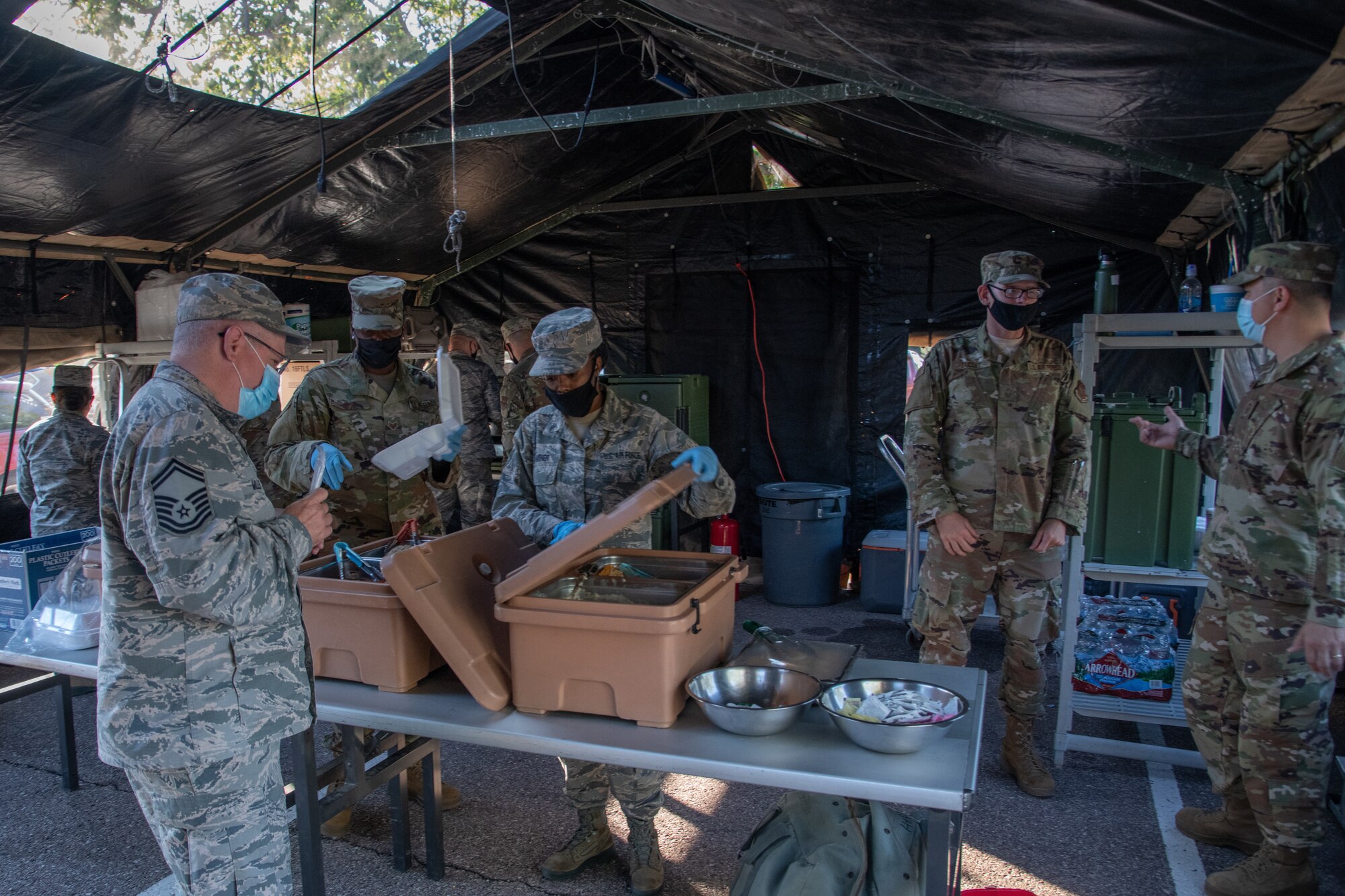 Reservists serve breakfast to members of the 302nd Airlift Wing during a unit training assembly.