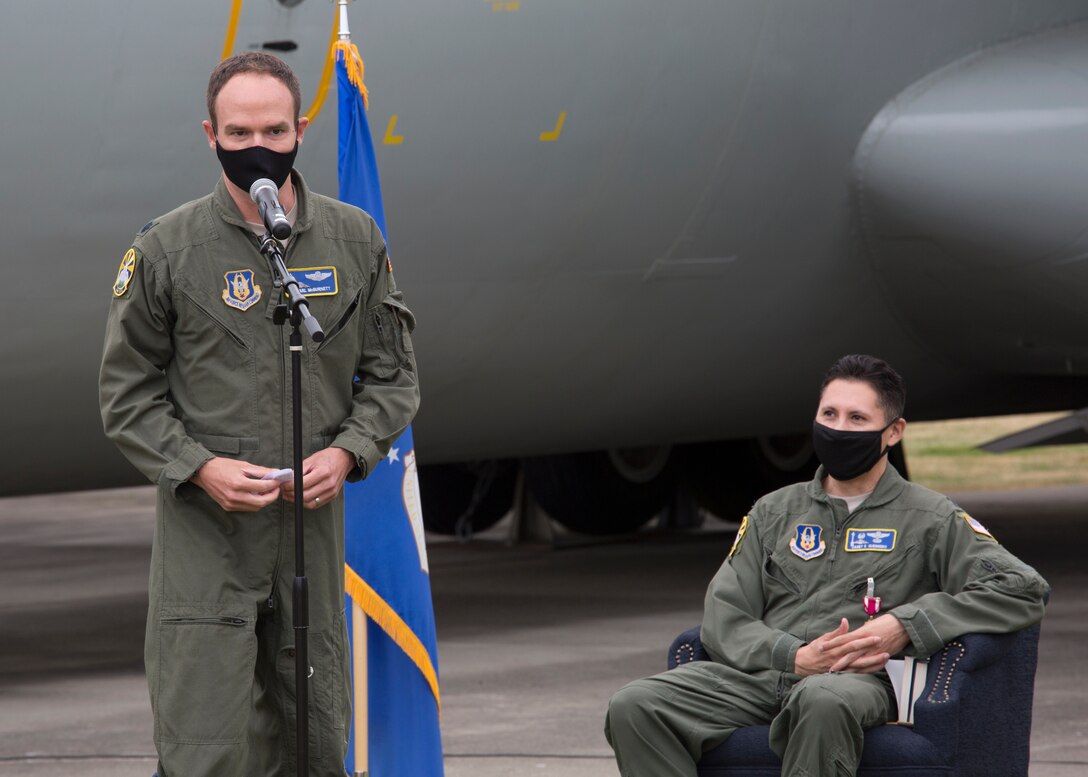 One pilot speaks while another pilot sits