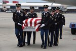 The Pennsylvania National Guard’s Military Funeral Honors detail conducts a dignified transfer of remains for U.S. Army Cpl. Jackey Dale Blosser on July 30, 2020, at Pittsburgh International Airport. Blosser, of Randolph County, West Virginia, went missing in action Dec. 2, 1950, during the Korean War.