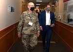 Lt. Col. Woody Groton, exercise director of Cyber Yankee 2020, leads N.H. Gov. Chris Sununu on a tour of the event on July 31, 2020, at the Edward Cross Training Center in Pembroke, N.H.