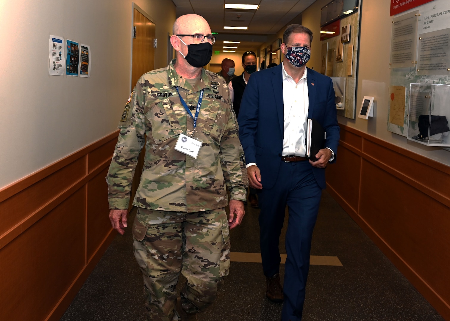 Lt. Col. Woody Groton, exercise director of Cyber Yankee 2020, leads N.H. Gov. Chris Sununu on a tour of the event on July 31, 2020, at the Edward Cross Training Center in Pembroke, N.H.