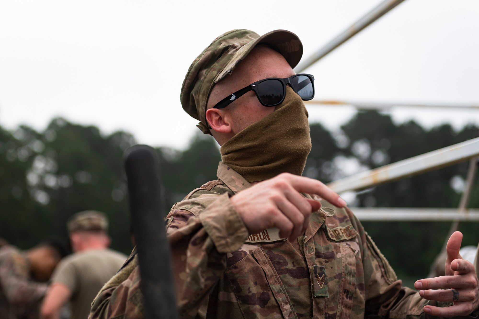 A photo of an Airman instructing students.