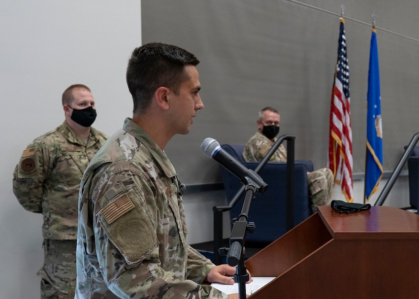 United States Air Force Maj. Michael Lundy, 1st Munitions Squadron commander, speaks to invited guests and members of the 1st Munitions Squadron during the unit’s official reactivation and assumption of command ceremony held July 31, 2020 at Joint Base Langley-Eustis, Virginia. (US. Air Force photo by Nicholas J. De La Pena)