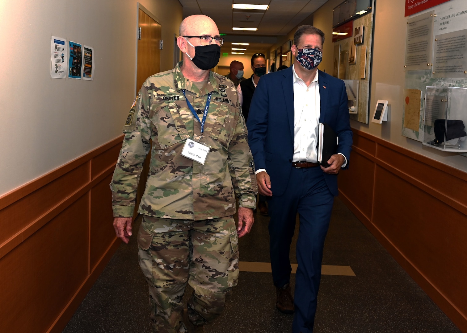 New Hampshire National Guard Lt. Col. Woody Groton, exercise director of Cyber Yankee 2020, leads New Hampshire Gov. Chris Sununu on a tour of the event on July 31, 2020, at the Edward Cross Training Center in Pembroke, N.H. The two-week regional exercise enhanced the Guard's ability to respond to cyberattacks against state government and critical infrastructure.