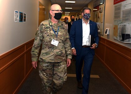 New Hampshire National Guard Lt. Col. Woody Groton, exercise director of Cyber Yankee 2020, leads New Hampshire Gov. Chris Sununu on a tour of the event on July 31, 2020, at the Edward Cross Training Center in Pembroke, N.H. The two-week regional exercise enhanced the Guard's ability to respond to cyberattacks against state government and critical infrastructure.