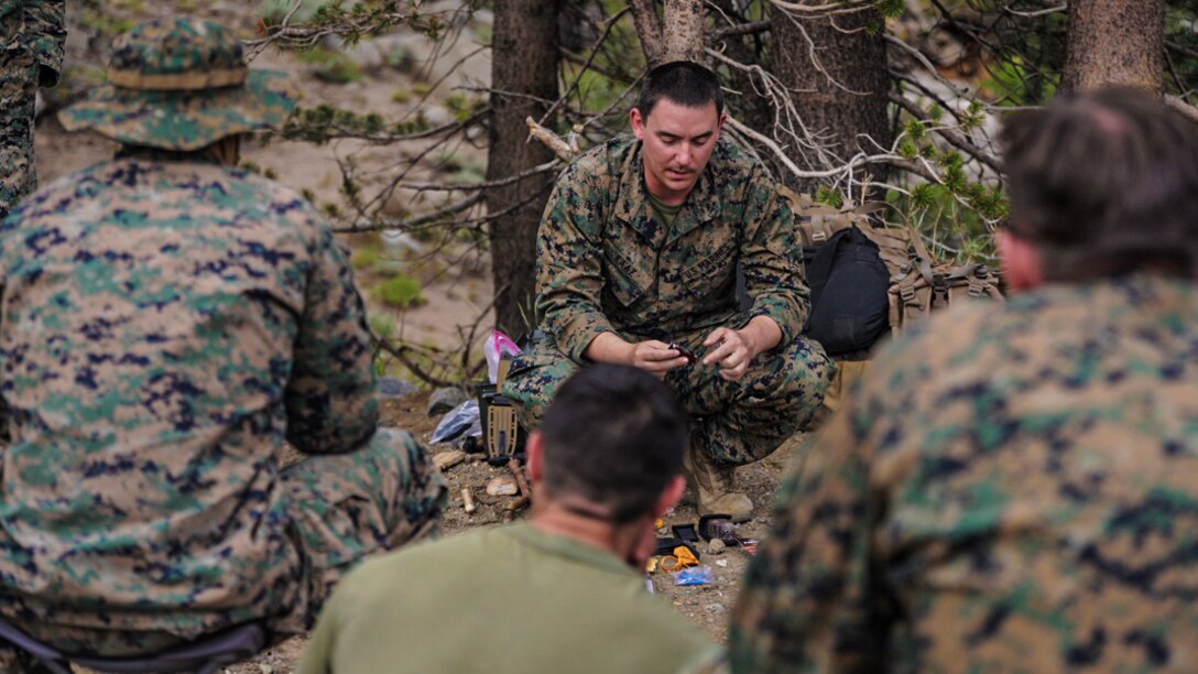 A U.S. Marine teaches a survival class to Marines during a guided training course aboard MCMWTC, Bridgeport, Calif., July 26.