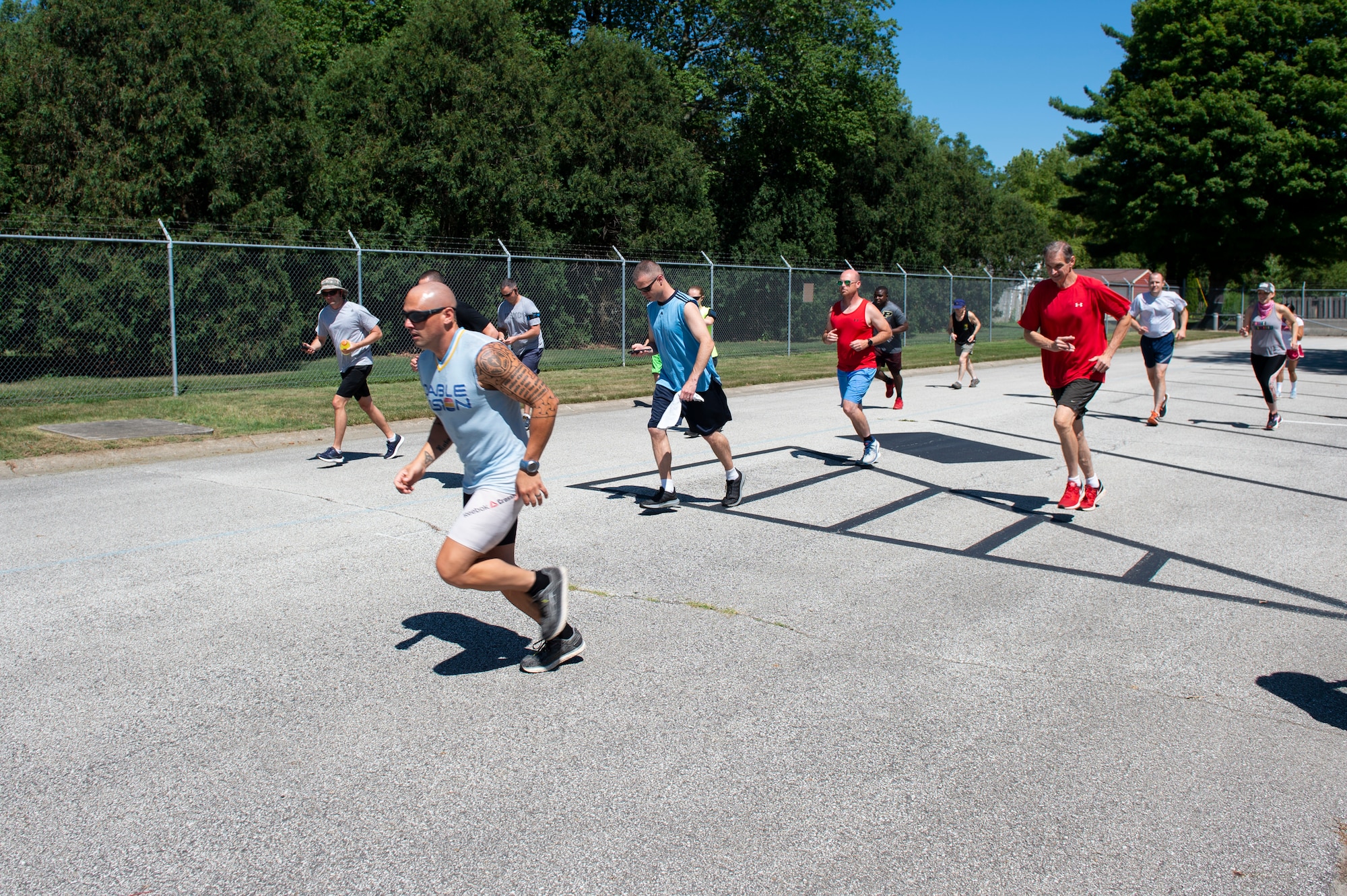 Participants start to run during the Dog Days of Summer 5K at Grissom Air Reserve Base, Indiana, July 29, 2020. Senior Airman Jeremiah Oden, 434th Operation Support Squadron survival, evasion, resistance, and escape specialist, finished first in the race. (U.S. Air Force photo by Senior Airman Michael Hunsaker)
