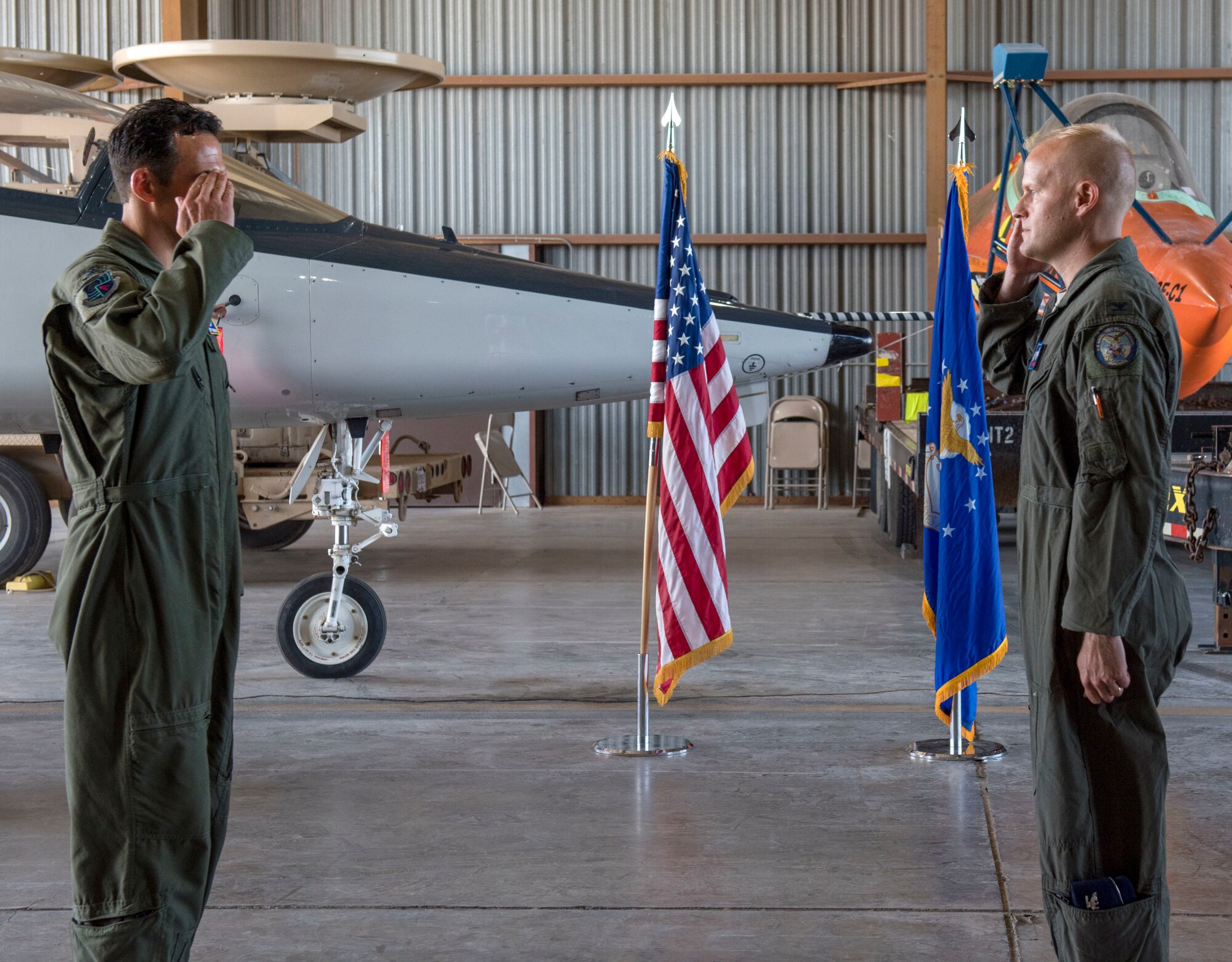AEDC Commander Col. Jeffrey Geraghty, left, and the new 704th Test Group Commander Col. Darren Wees exchange salutes during a Change of Command ceremony July 1 at Holloman Air Force Base, New Mexico. On that date, Wees officially assumed command of the 704 TG. (U.S. Air Force photo by Airman 1st Class Quion Lowe)