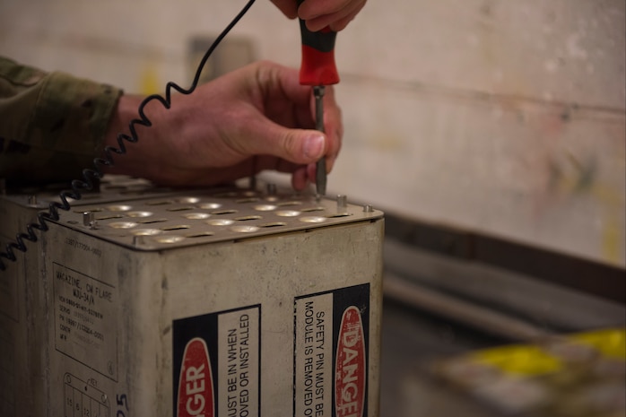 Airman 1st Class Cory Klingener, a conventional maintenance crew member  assigned to the 437th Maintenance Squadron, replaces flares in a flare set, July 20, 2020, at Joint Base Charleston, S.C. The flares are used on aircraft in order to attempt to divert attention when the aircraft is believed to be in danger. This is just one task the munitions flight has to perform, other tasks include flightline support, base support, and NASA and SpaceX support.