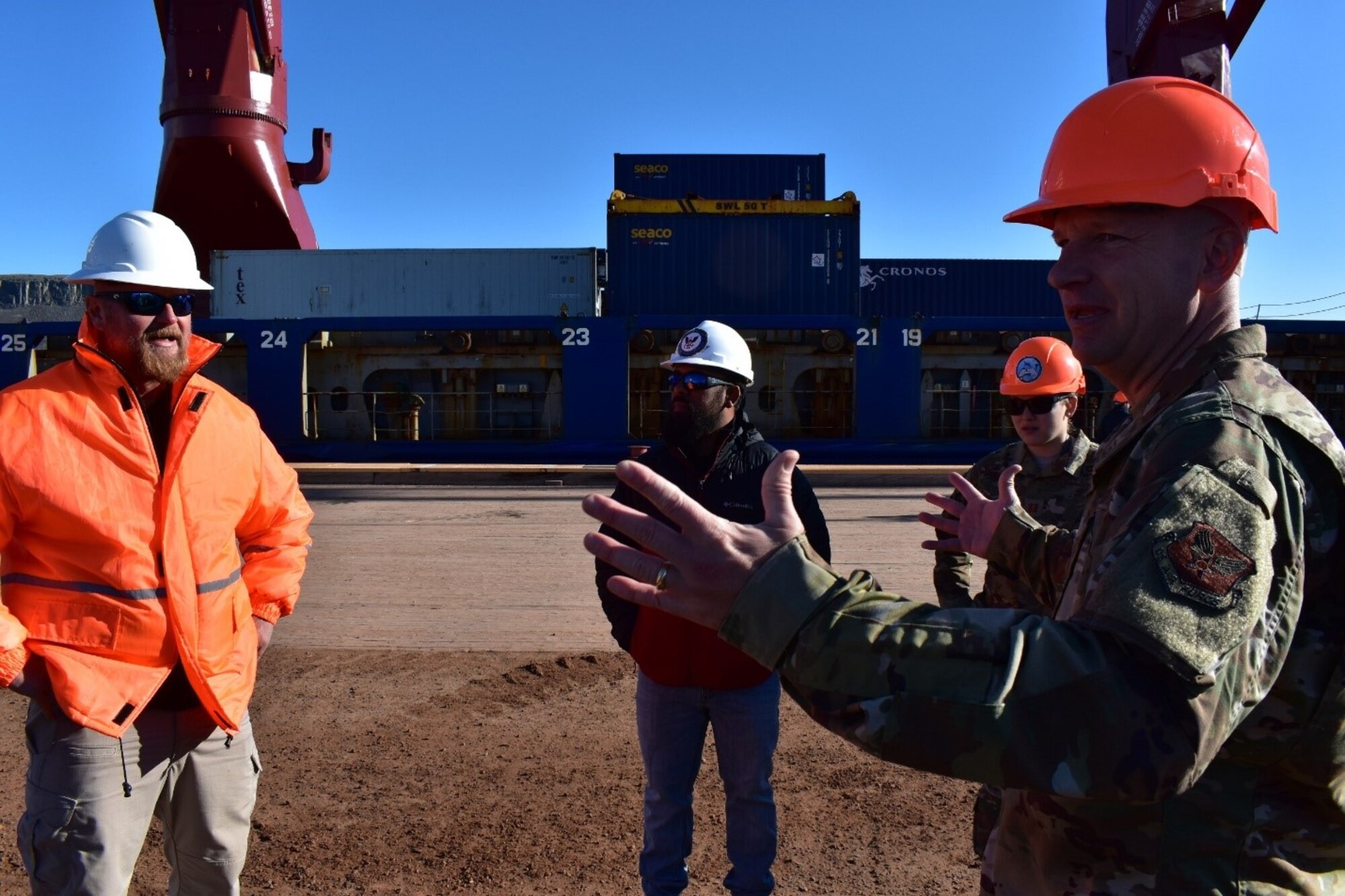 Col. David Hanson, 821st Air Base commander, discusses the importance of the base re-supply mission with the cargo ship’s captain and Military Sea Lift Command representative in July 2020. Pacer Goose is the annual re-supply mission to support the base with cargo and fuel. This year’s mission offloaded 6.4 million gallons of fuel and 2.7 million pounds of cargo for distribution across base units. In total, 98 items were offloaded, to include connexes, a five-piece firing range module and various rolling stock, such as a brand new Oshkosh Sriker P19 fire truck, a rock crusher and a 48-ft stepdeck trailer. The operation was the result of months long planning and coordination between the 821st Air Base Group, Peterson-Schriever Garrison, Military Sealift Command, U.S. Transportation Command and the U.S. Embassy in Denmark. (Courtesy photo)
