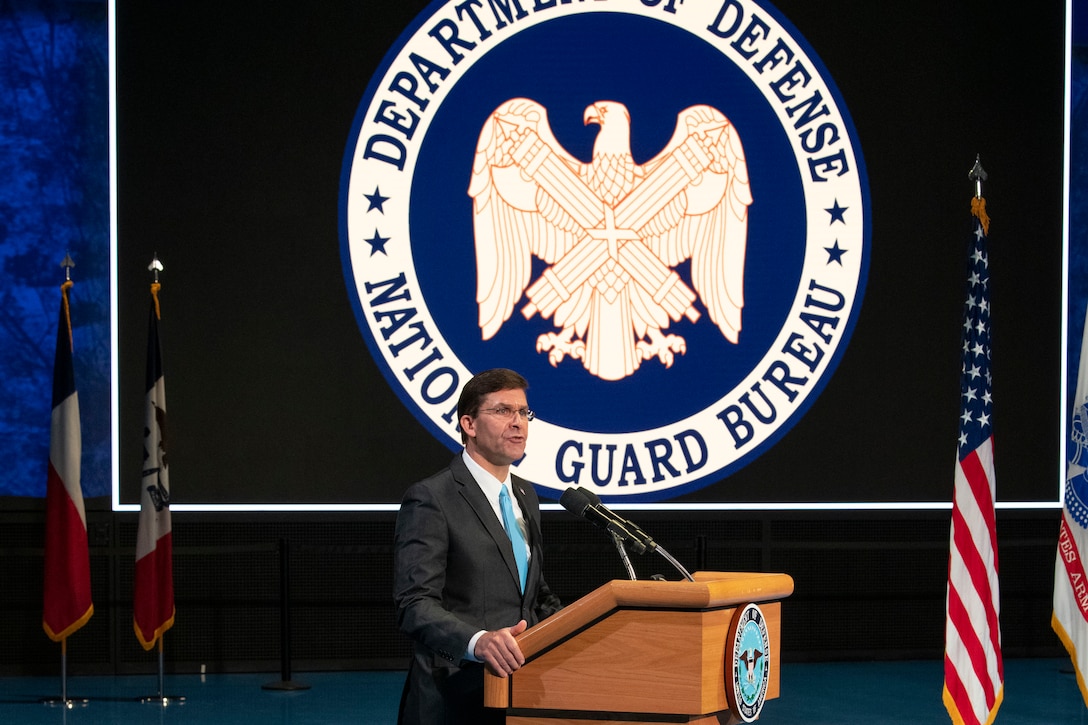 Defense Secretary Dr. Mark T. Esper speaks at lectern.