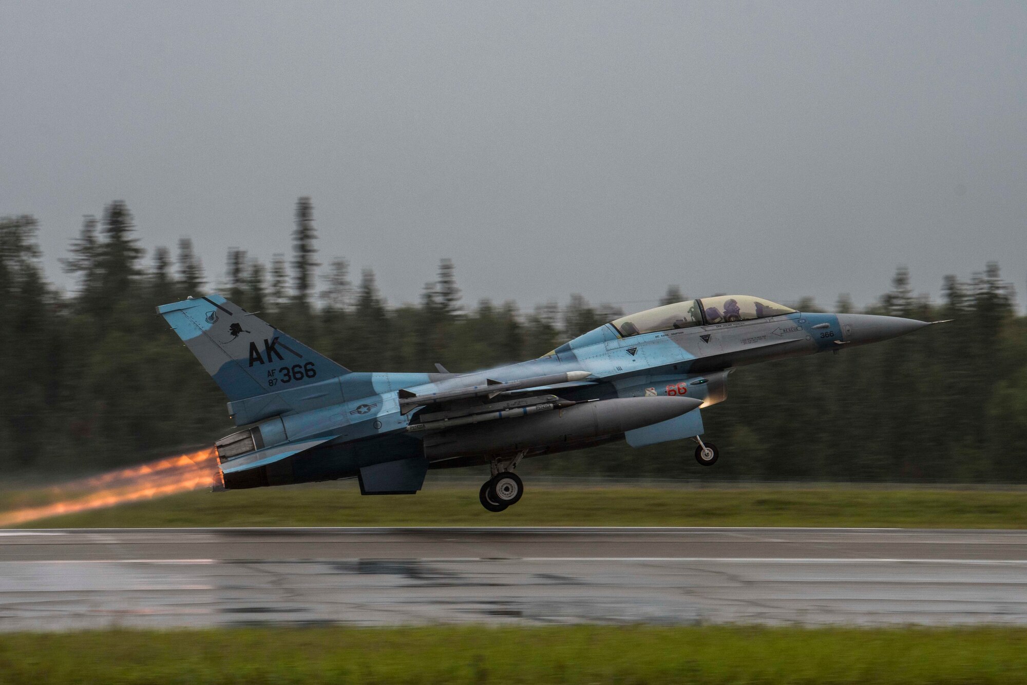A U.S. Air Force F-16 Fighting Falcon, assigned to the 18th Aggressor Squadron, takes off during RED FLAG-Alaska (RF-A) 20-3 at Eielson Air Force Base, Alaska, Aug. 3, 2020. RF-A gives aviators an opportunity to hone skills required in combat by providing training scenarios designed to replicate near-peer adversary tactics, techniques and procedures in a controlled environment. (U.S. Air Force photo by Airman 1st Class Aaron Larue Guerrisky)