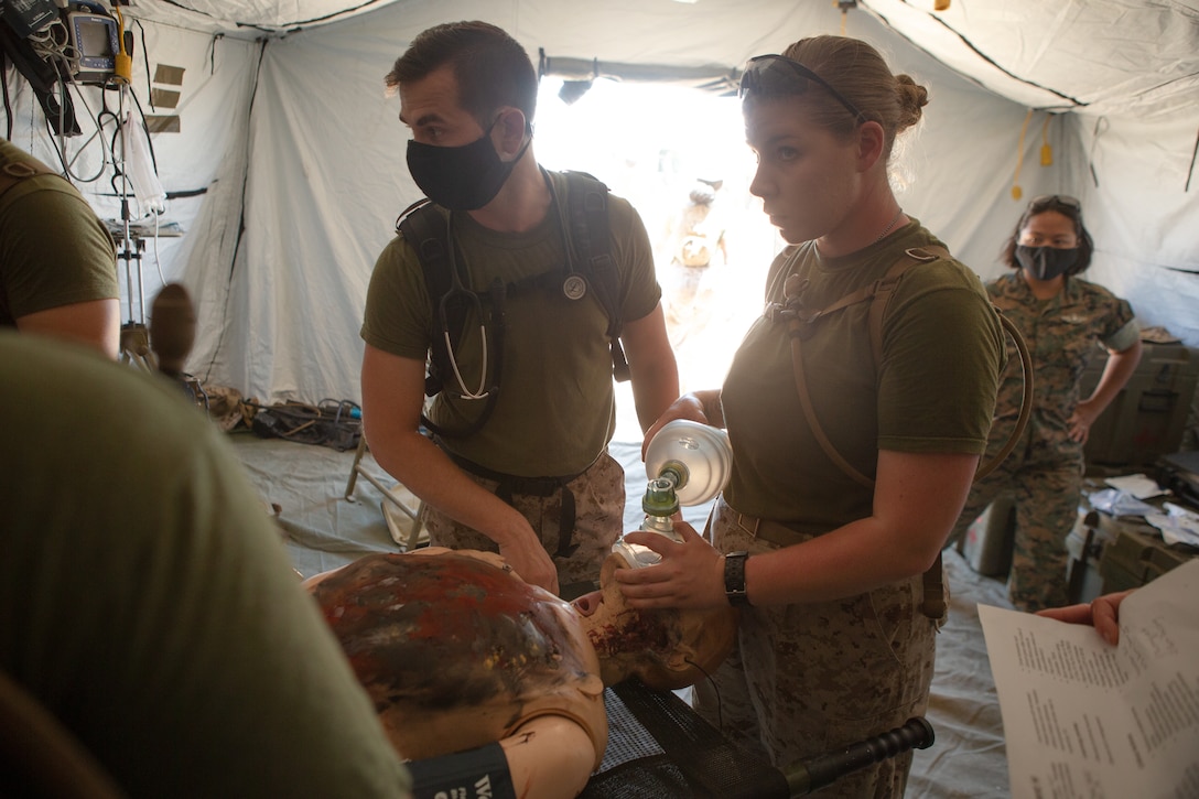 U.S. Navy Corpsmen with 1st Medical Battalion, 1st Marine Logistics Group, provide medical attention to a training dummy during Exercise Four Horsemen on Camp Pendleton, California, 16 July, 2020. The purpose of this exercise is to assess mission and logistical readiness. The Mission of 1st Medical Battalion is to provide health service support to the operational units of the I Marine Expeditionary Force (I MEF).  (U.S. Marine Corps photo by Sgt. Kyle McNan)