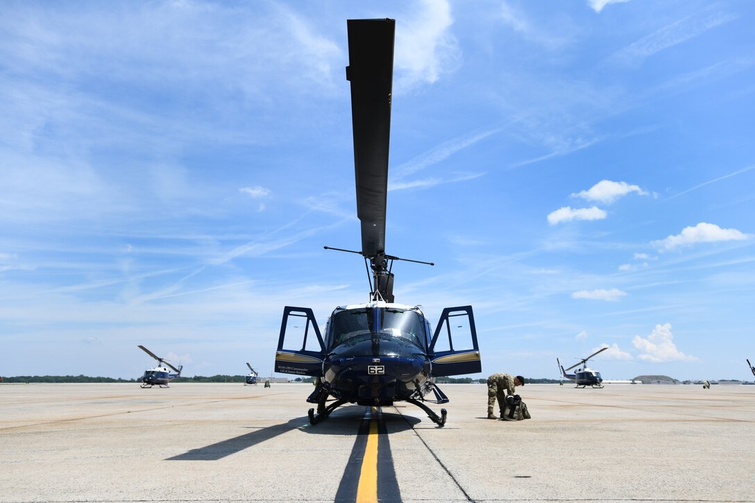 Lt. Col. Scott Dunning, 2nd Lt. Andre Young and Staff Sgt. Adrian Acasio, flight crew from the 1st Helicopter Squadron, prepare for takeoff on Joint Base Andrews, Md., July 30, 2020.