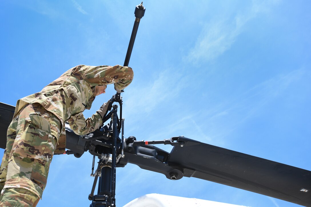 2nd Lt. Andre Young, 1st Helicopter Squadron pilot, helps conduct a preflight inspection before a training flight on Joint Base Andrews, Md., July 30, 2020.