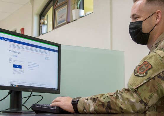 A photo of U.S. Air Force Master Sgt. David Popp, 44th Aerial Port Squadron assistant aerial port manager, signing onto a newly installed computer at Andersen Air Force Base, Guam, July 28, 2020. The Reserve Citizen Airman was part of a team that conducted a workspace utilization study that led to the creation of his squadron’s first phase of their cybercafe. (U.S. Air Force photo by Tech. Sgt. Tricia C. Topasna)