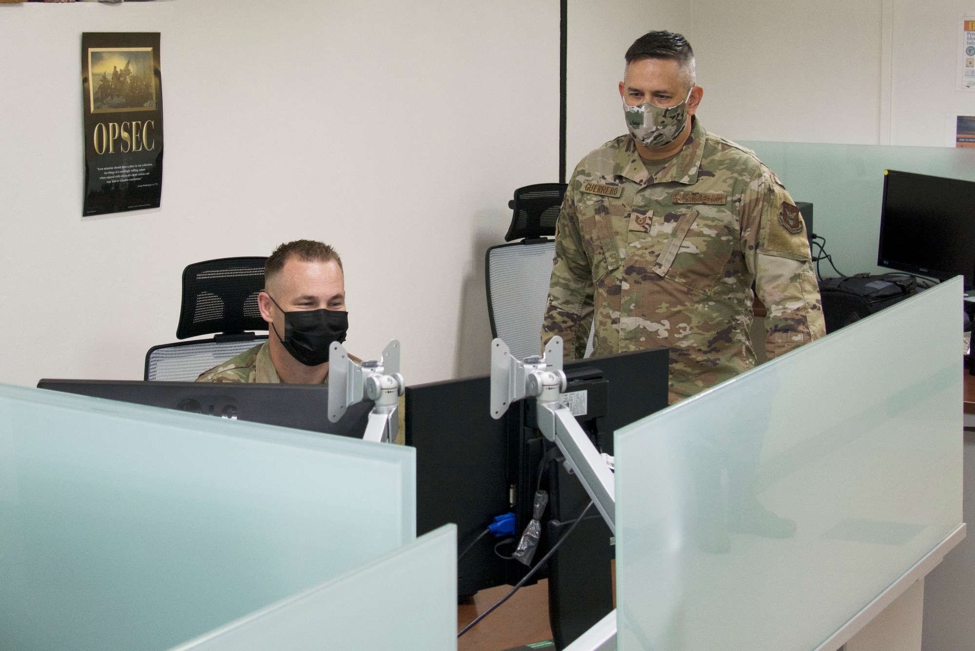 A photo of U.S. Air Force Master Sgt. David Popp, left, and Tech. Sgt. Kerry Guerrero of the 44th Aerial Port Squadron utilize the recently built cybercafe at Andersen Air Force Base, Guam, July 28, 2020. The cybercafe was created to increase internet accessibility by optimizing workspace utilization through the use of squadron innovation funds from AFWERX, the Air Force’s innovation program. (U.S. Air Force photo by Tech. Sgt. Tricia C. Topasna)