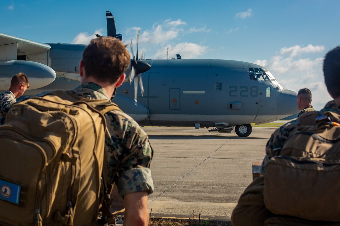 U.S. Marines standby to enter a KC-130J Hercules at Marine Corps Air Station Cherry Point, North Carolina, July 31.