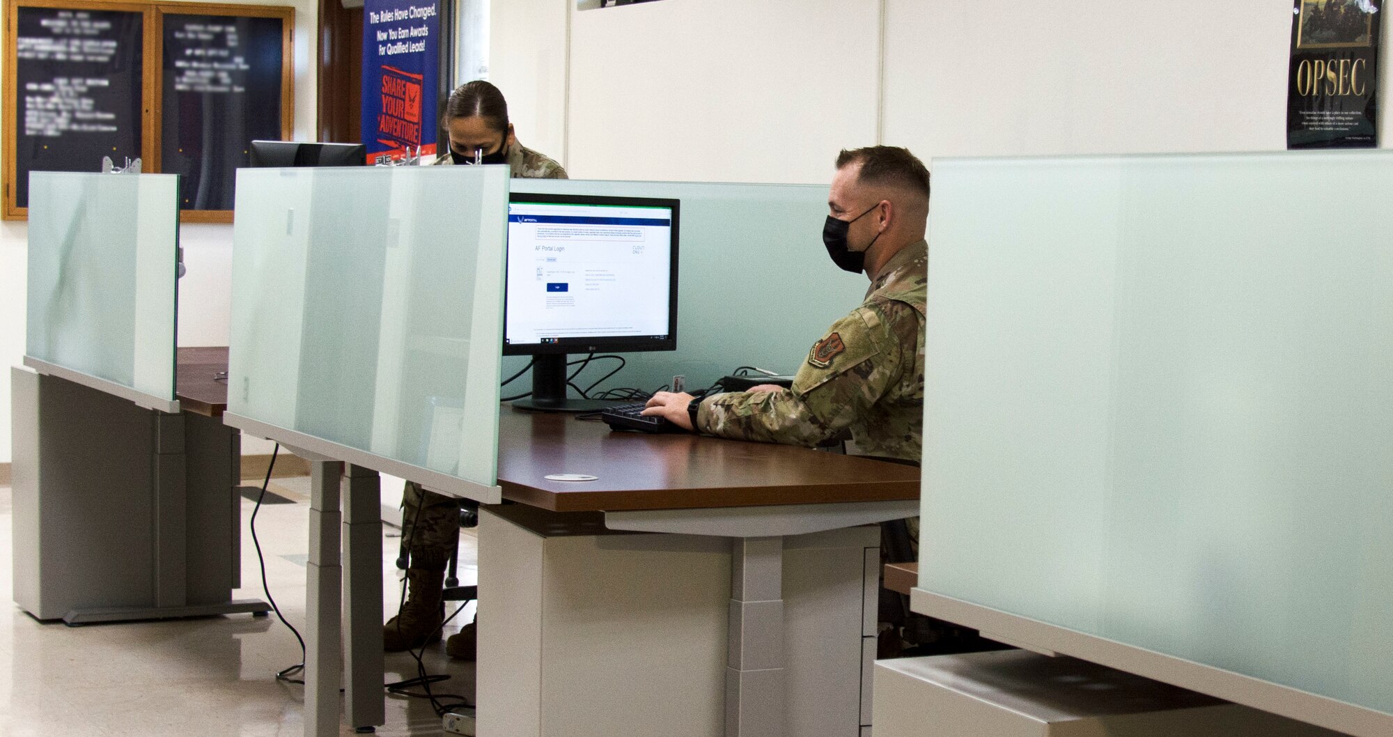 Photo of U.S. Air Force Master Sgt. Louisa Togawa, left, and Master Sgt. David Popp of the 44th Aerial Port Squadron utilizing the recently built cybercafe at Andersen Air Force Base, Guam, July 28, 2020. The cybercafe was created to increase internet accessibility by optimizing workspace utilization through the use of squadron innovation funds from AFWERX, the Air Force’s innovation program. (U.S. Air Force photo by Tech. Sgt. Tricia C. Topasna)