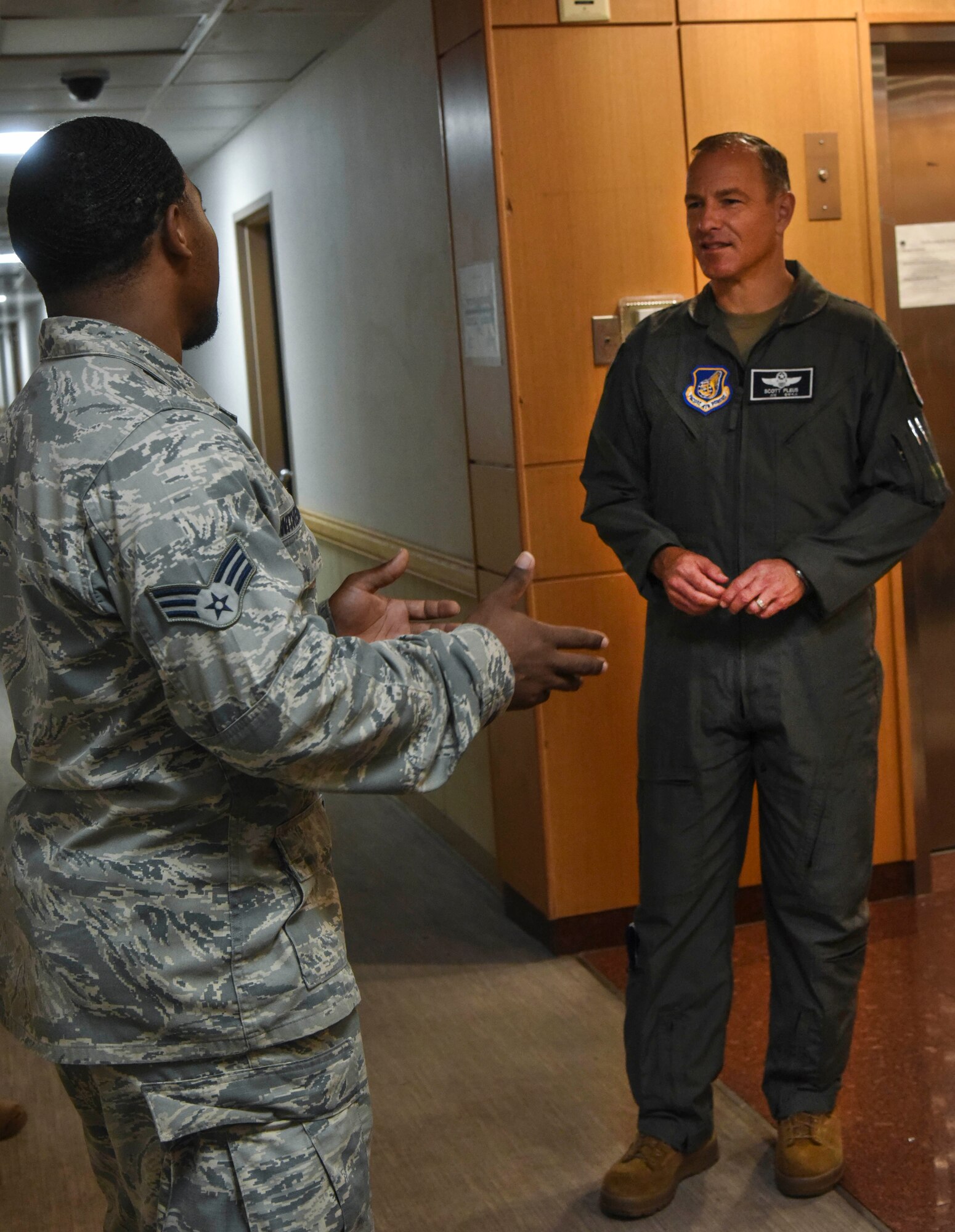 Senior Airman Kevin Witherspoon, 8th Civil Engineering Squadron heating, ventilation, air conditioning and refrigeration technician, briefs Lt. Gen. Scott Pleus, Seventh Air Force commander, on issues within the dorms on Kunsan Air Base, July 29, 2020.