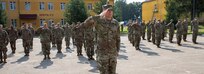 Soldiers with Task Force Illini, 33rd Infantry Brigade Combat Team, Illinois National Guard present arms during a transfer of authority ceremony where Task Force Illini assumed command of Joint Multinational Training Group-Ukraine at Collective Training Center –Yavoriv, Ukraine, July 30, 2020. (U.S. Army photo by Sgt. Gregory Glosser)